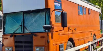 Big Orange School bus parked in scenic location
