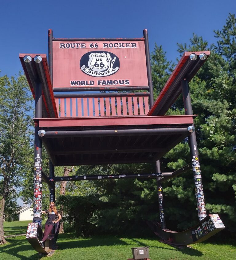World's Second Largest Rocking Chair at Fanning 66 Outpost in Cuba Missouri with pink striped awning