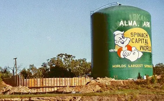 World's Largest Spinach Can water tower in Alma Arkansas in the 1990s showing Popeye branding