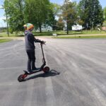 Riding an off-road scooter on our road trip during our accidental search for world’s largest roadside attractions