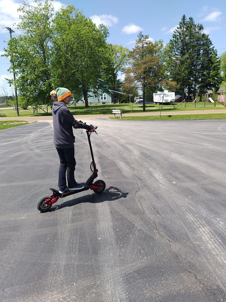 Riding an off-road scooter on our road trip during our accidental search for world’s largest roadside attractions