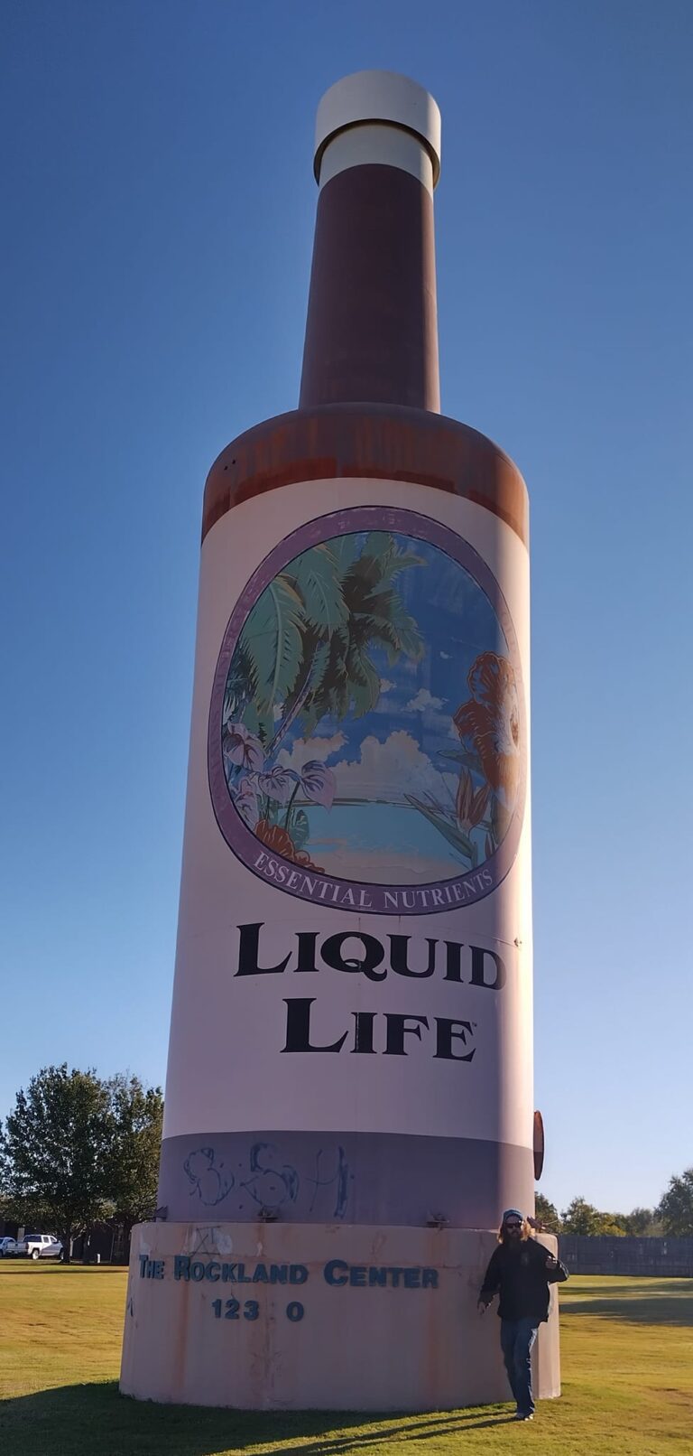 The World's Largest Bottle of Hair Tonic, a quirky tribute to vintage hair care advertisements.