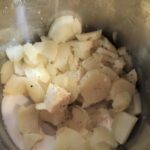 Mashing potatoes in RV kitchen