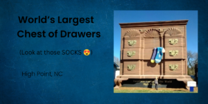 Giant chest of drawers roadside attraction in High Point, North Carolina, with oversized blue socks hanging from one drawer.