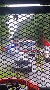 Emergency response during Michigan Bus Break: flashing lights, roadside chaos, and a view through the bus mesh of police and fire crews in action