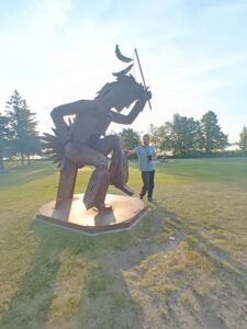 Things to do in Minnesota - Nancy at Native American statue in Bemidji