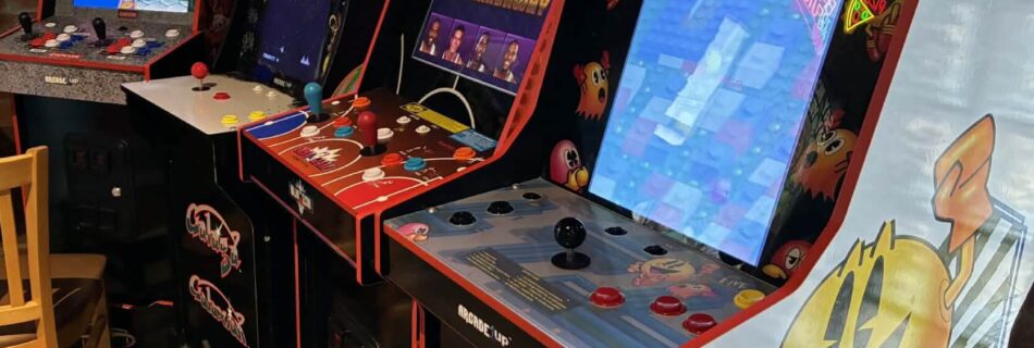 Vintage arcade games including Pac-Man, NBA Jam, and Galaga at Flashback Pizza & Milkshakes in Rogers, Arkansas
