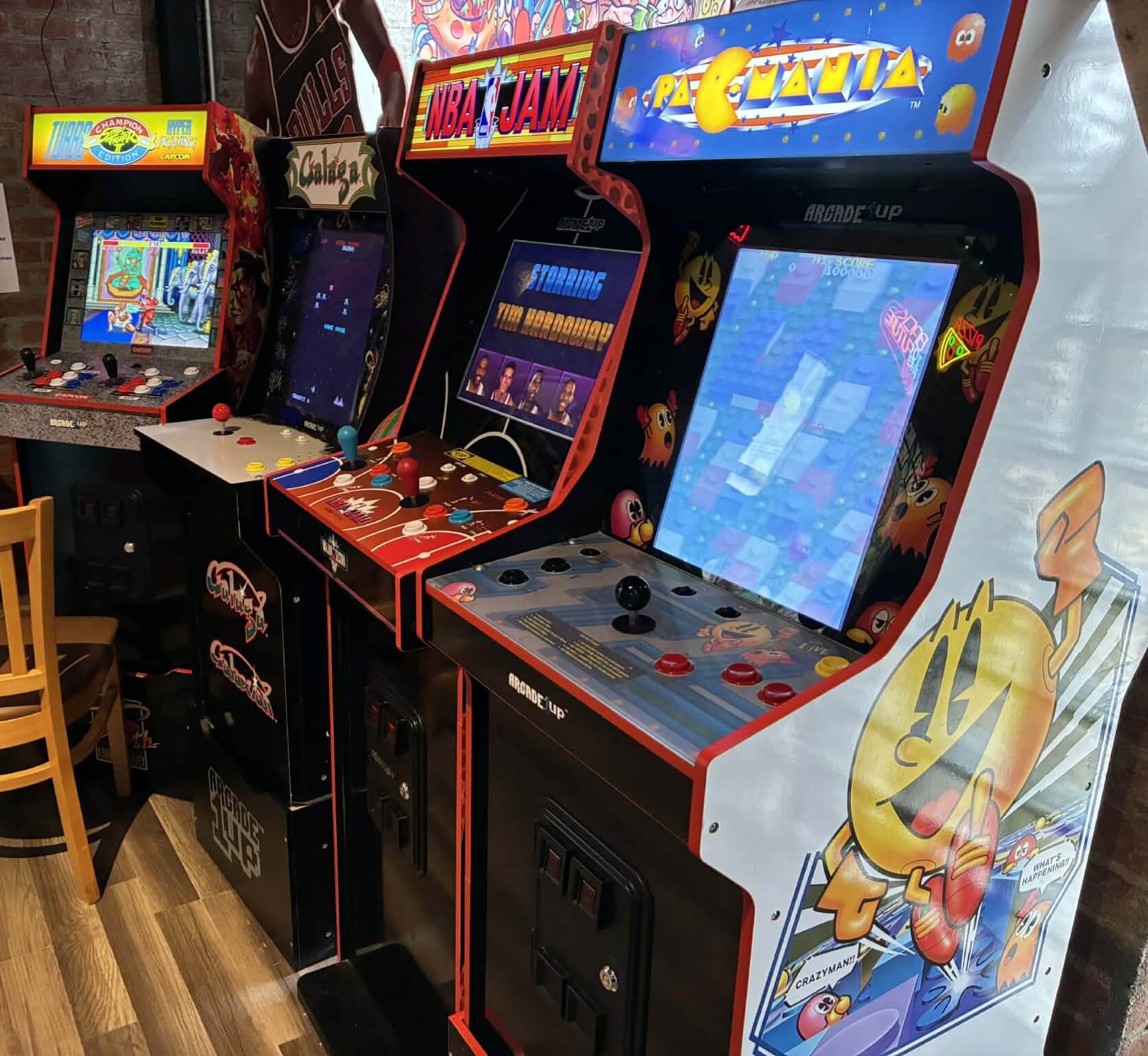 Vintage arcade games including Pac-Man, NBA Jam, and Galaga at Flashback Pizza & Milkshakes in Rogers, Arkansas