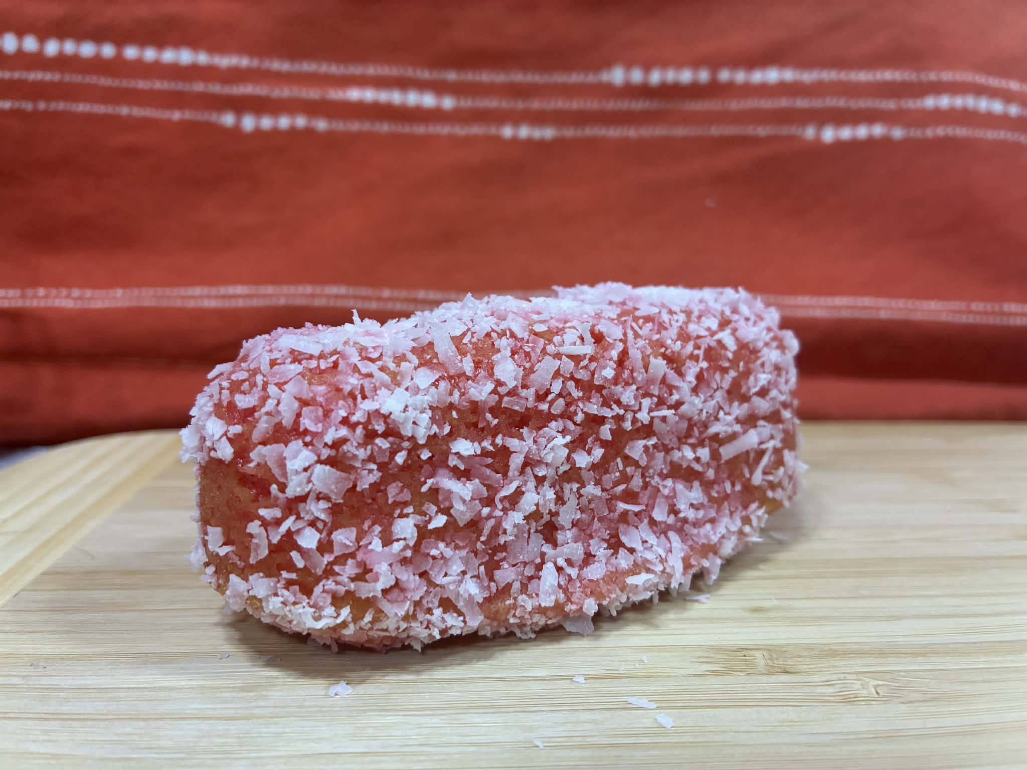 Homemade raspberry Zingers coated in pink coconut