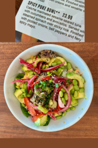 Spicy poke bowl with sesame-seared tuna, avocado, cucumbers, and pickled onions at Salt Life Food Shack