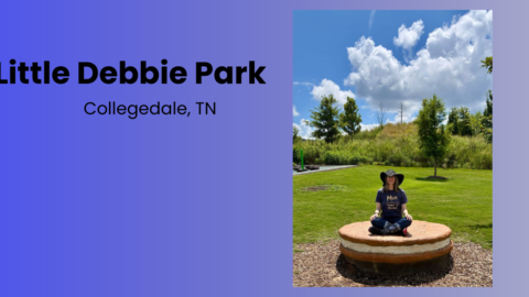 Nancy sitting cross-legged on a giant Oatmeal Creme Pie at Little Debbie Park in Collegedale, Tennessee.