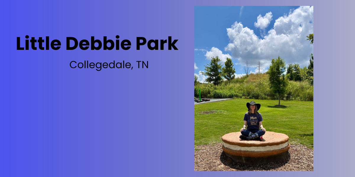 Nancy sitting cross-legged on a giant Oatmeal Creme Pie at Little Debbie Park in Collegedale, Tennessee.