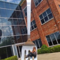 World's Largest Fork by mass with man hanging on to it.