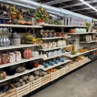 A to Z Gifts Alma Arkansas home decor aisle showing shelves stocked with vases, seasonal decorations, and household items in the large retail store