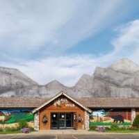 Call of the Wild storefront in Gaylord Michigan with mountain mural and rustic wooden facade