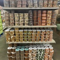 A to Z Gifts Alma Arkansas craft section endcap display filled with spools of ribbon in various colors and patterns for crafting projects
