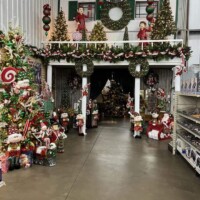 A to Z Supply Alma Arkansas Christmas display with decorated trees, wreaths, and holiday decorations throughout the large store