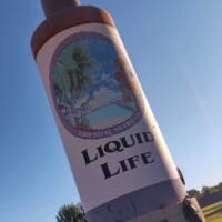 lose-up of Tulsa’s 25-foot Hair Tonic Bottle, showcasing its detailed label and structure.