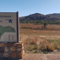 Wichita Mountains trail map with Mount Scott peak visible in background landscape