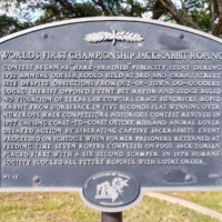 Blue historical plaque describing World's First Championship Jackrabbit Roping event in Odessa with small jackrabbit logo at bottom