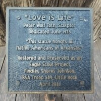 Dedication plaque for Peter Wolf Toth's 'Love is Life' Whispering Giant sculpture, showing original 1975 dedication and 1998 Eagle Scout restoration project details