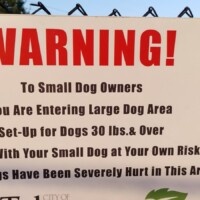 Large dog area warning sign at Benjamin's Biscuit Acres Dog Park Tulsa.