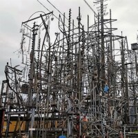 Towering welded steel structure at Billy Tripp’s Mindfield Brownsville TN, with interconnected beams, rods, and wires forming an intricate, layered outdoor art installation.