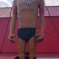 Large Native American-style statue wearing a feathered headdress and black loincloth, formerly located outside Pratt’s BBQ in Kingsport, TN.