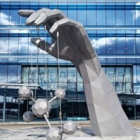 Hand holding molecules sculpture Eastman Chemical Johnson City side view