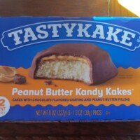 A box of Tastykake Peanut Butter Kandy Kakes on a wooden table