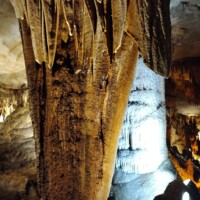 Massive column formation inside Fantastic Caverns in Springfield, Missouri, where stalactite and stalagmite have joined to create a towering mineral structure.