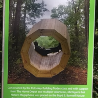 Informational sign for the Nature Megaphone at Agnes Andreae Nature Preserve Michigan — includes photo of wooden acoustic sculpture and construction credits