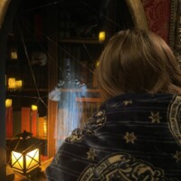 Person wrapped in a celestial-patterned blanket standing in front of a mystical display with books, candles, and a ghostly blue figure, under warm lantern light.