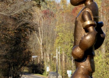 Popeye statue and Welcome to Chester sign in Illinois hometown of creator - quirky roadside attraction