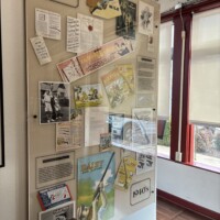 1930s Daisy Airgun advertising and newspaper clippings displayed on a museum wall at the Daisy Airgun Museum in Rogers, Arkansas