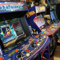 X-Men and Marvel arcade games with colorful joysticks at Flashback Pizza & Milkshakes in Rogers, Arkansas