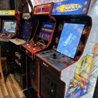 Vintage arcade games including Pac-Man, NBA Jam, and Galaga at Flashback Pizza & Milkshakes in Rogers, Arkansas