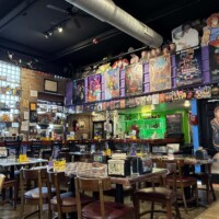 Interior of Flashback Pizza & Milkshakes showing 80s and 90s movie posters and retro decor in Rogers, Arkansas