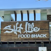 1:55 PM Salt Life Food Shack sign on the exterior wood facade in St. Augustine Beach Florida