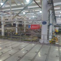Anheuser-Busch bottling line with a large Budweiser sign visible near marker 201.
