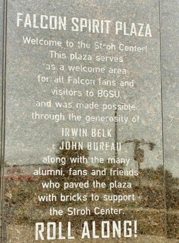 Falcon Spirit Plaza dedication plaque outside the Stroh Center, crediting Irwin Belk and John Bureau